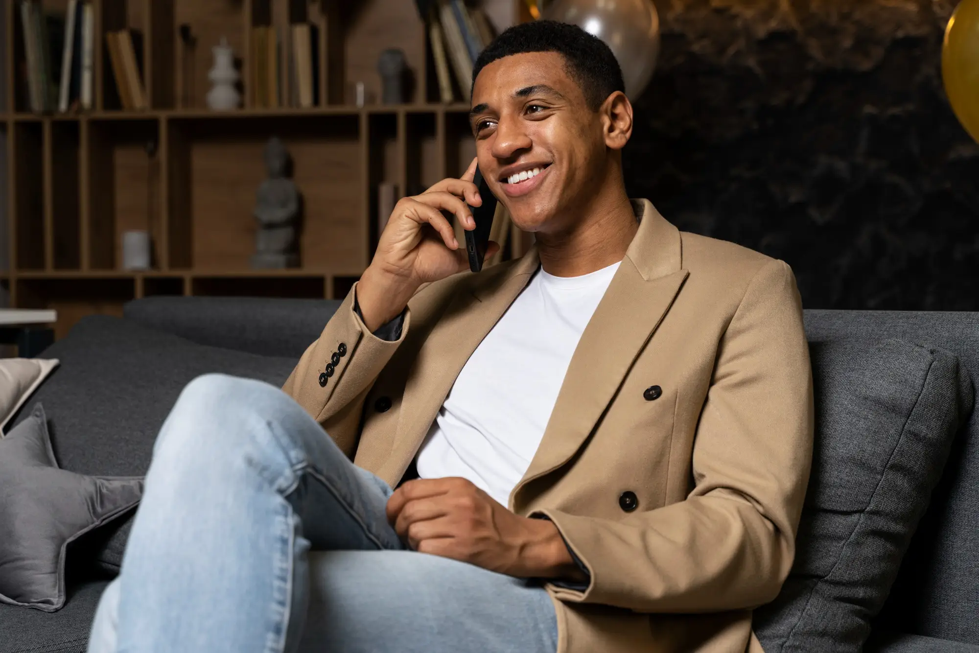 Black man enjoying a phone chat line conversation - TheFreePhoneChat for African American Men