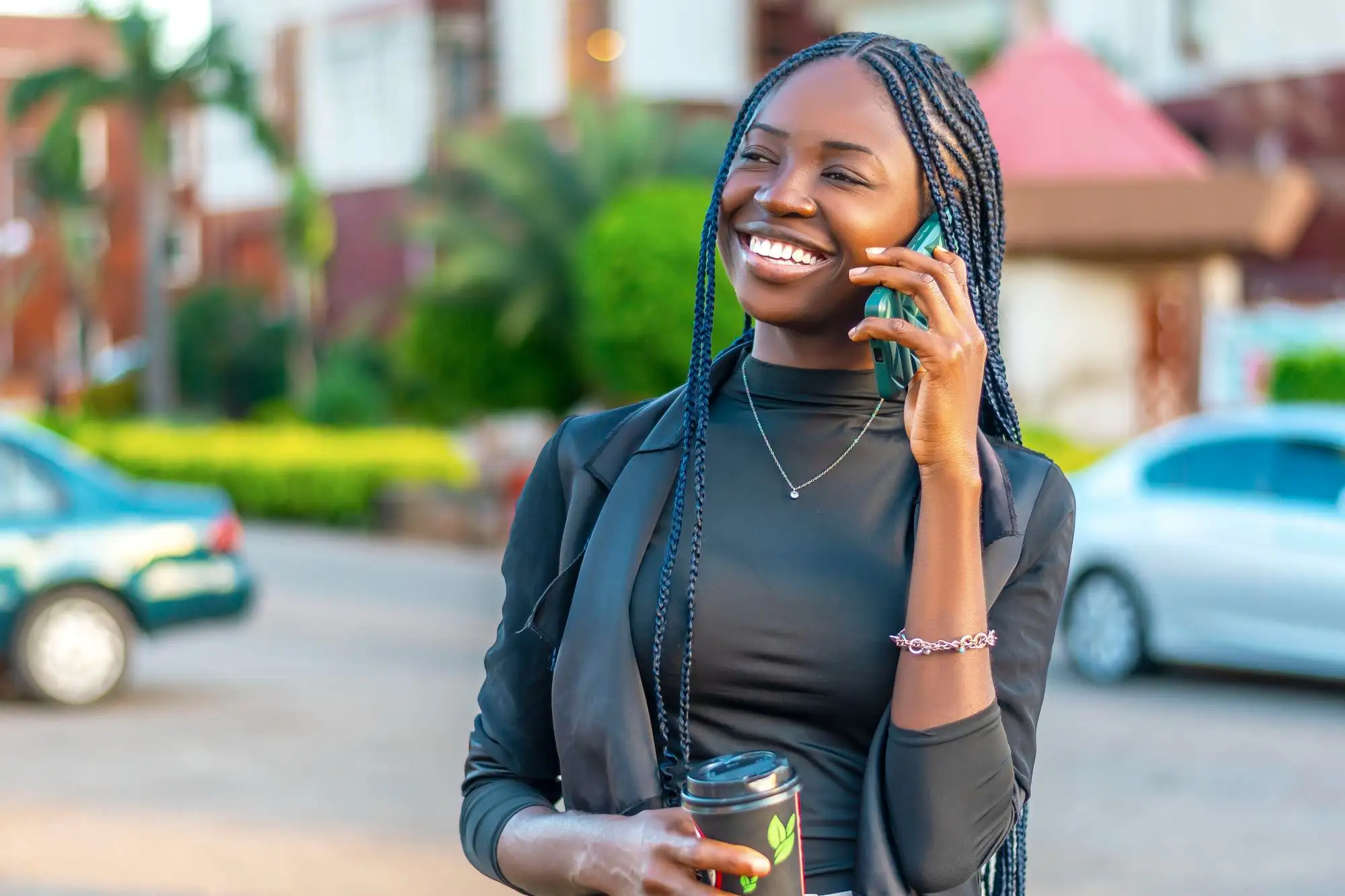 Black woman enjoying a phone chat line conversation - TheFreePhoneChat for African American Women